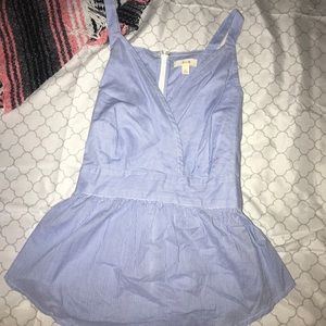 Low cut, cross front, tie back, peplum shirt